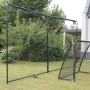 EXIT Backstop Sportnetz 300x600cm im Garten mit Fußballtor und Ball.