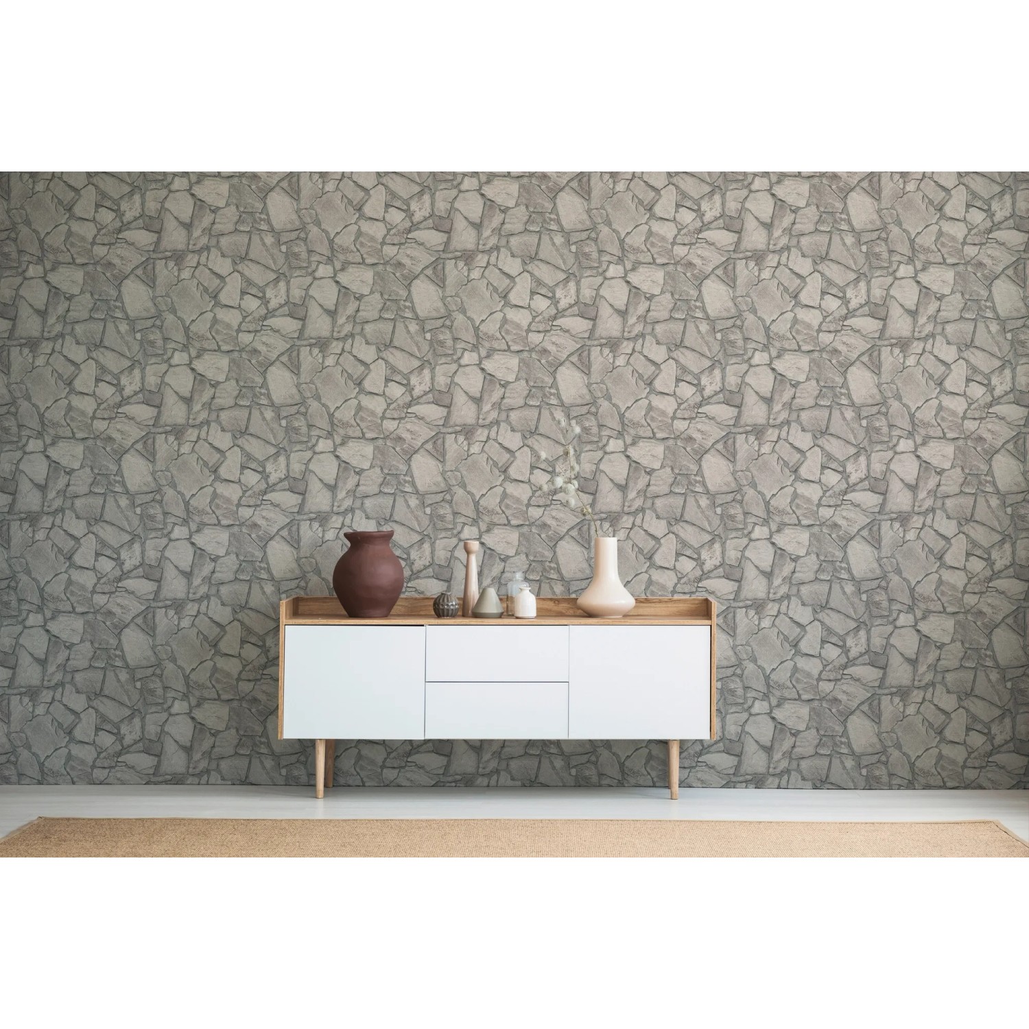 Graue Vliestapete mit Bruchsteinmauer Design von A.S. Création für rustikale Wandgestaltung.