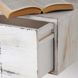 Weißes MCW Wandregal C55 mit Schublade im Shabby-Look und Buch.
