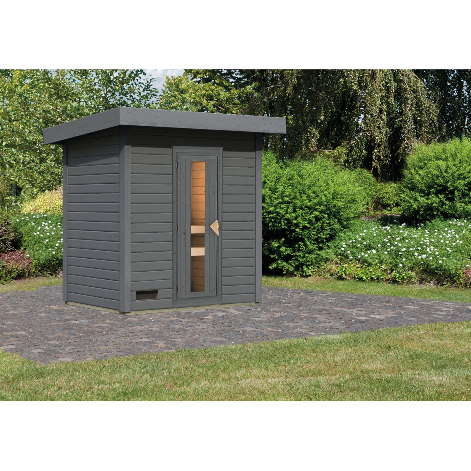 Karibu Saunahaus Arvi 1 in Terragrau mit Holztür und Glaseinsatz im Garten.