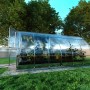 Klasika Gewächshaus 12m² mit Polycarbonat-Abdeckung im Garten.