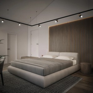 Schienensystem mit Ledvance Spot in Weiß-Gold über einem Schlafzimmer mit Bett und Holzpaneel.
