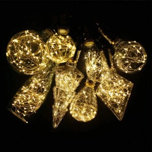 NETTLIFE LED Leuchtmittel: Verschiedene goldene Glasbirnen mit warmweißen Lichterketten, Sternen-Lichteffekt, E27.