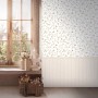 A.S. Création Vliestapete Wallpanel Blümchen Creme im Raum mit Fenster und Dekoration.
