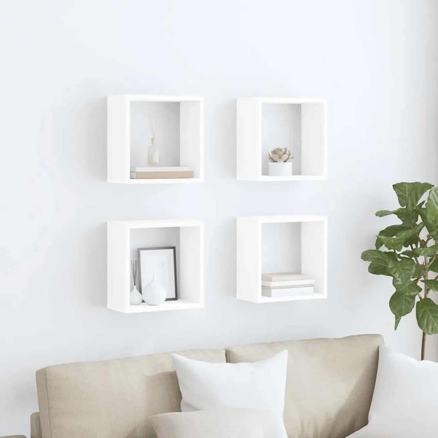 4 weiße vidaXL Würfelregale (30x15x30 cm) an einer Wand über einem Sofa.