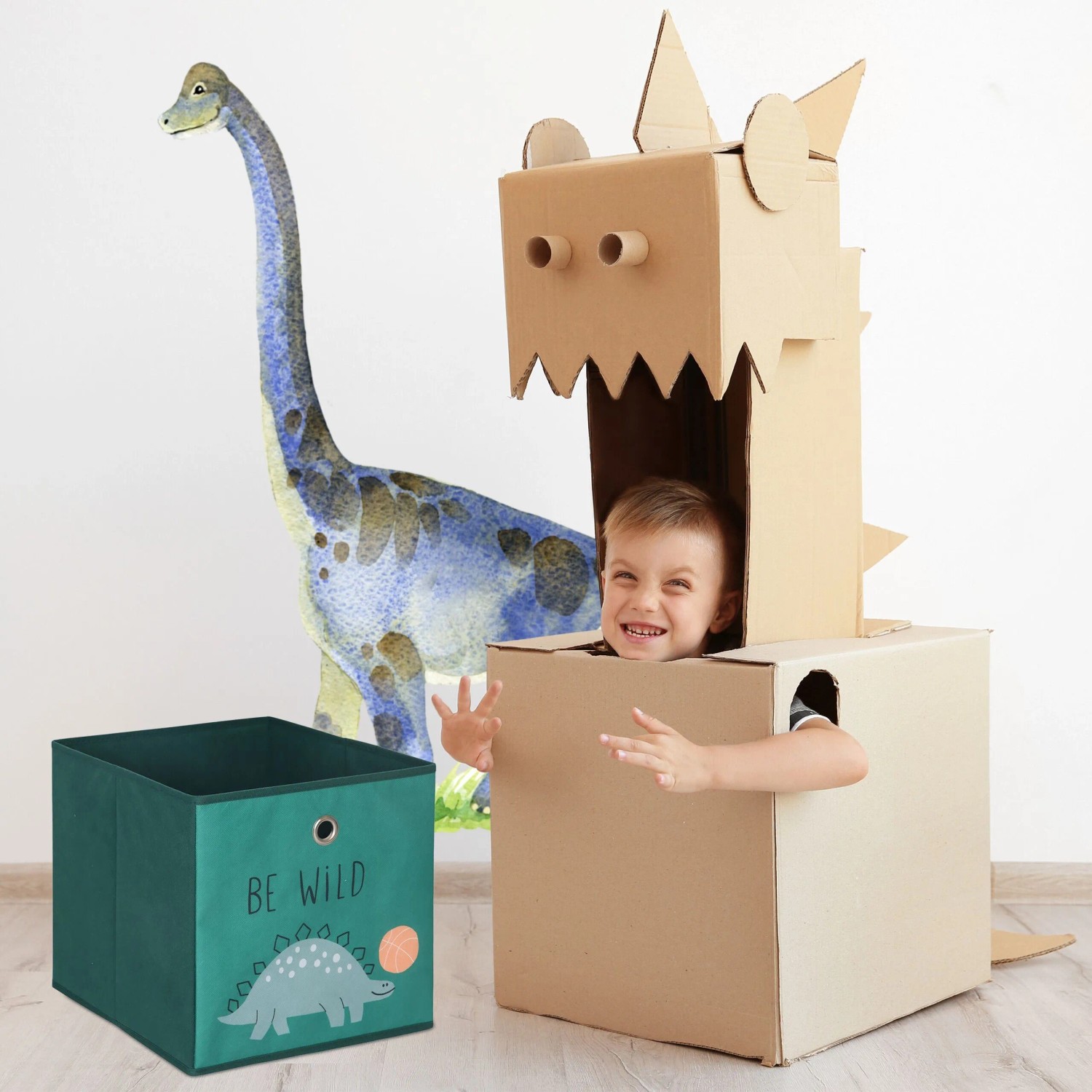 Grüne Kinder Aufbewahrungsbox mit Dino-Motiv und Kind im Karton-Dino. Faltbare Spielzeugkiste für Ordnung im Kinderzimmer.