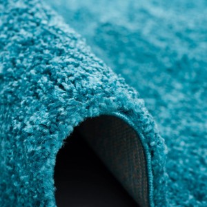 Detailansicht: Türkiser, runder Langflor Teppich Aloha (200cm) mit weicher Oberfläche.