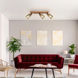 Briloner Deckenleuchte Royk, 3-flammig, mit Holzbasis und Rauchglas-Spots im Wohnraum.