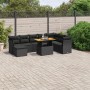 Schwarze 9-teilige Garten-Sofagarnitur aus Poly Rattan mit Tisch und Kissen.