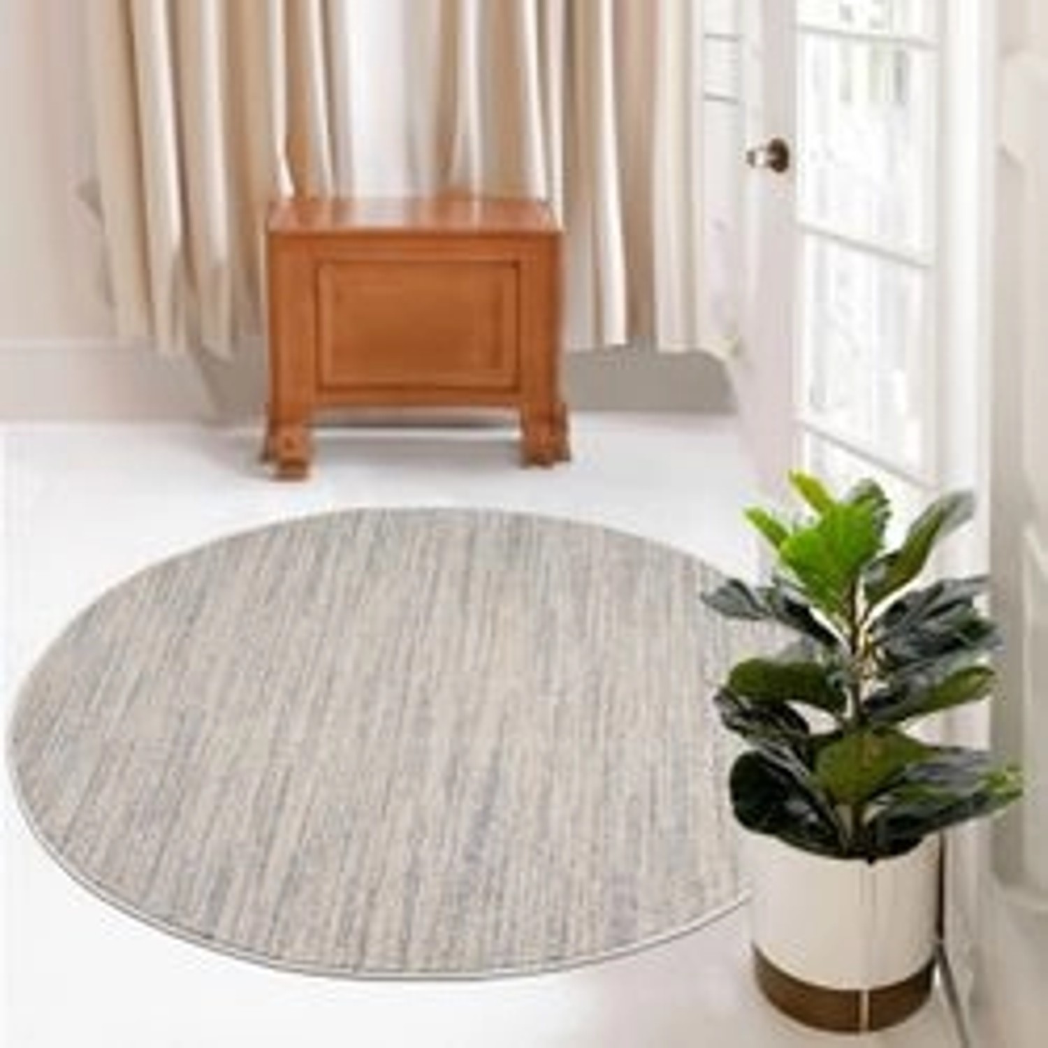 Runder, grauer payé Teppich Klassiko 52 mit Fransen, 160x160 cm. Kurzflor Teppich im Boho-Look.