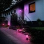 Philips Hue Impress Wegeleuchten und Wandleuchten in Szene gesetzt, leuchten pink.