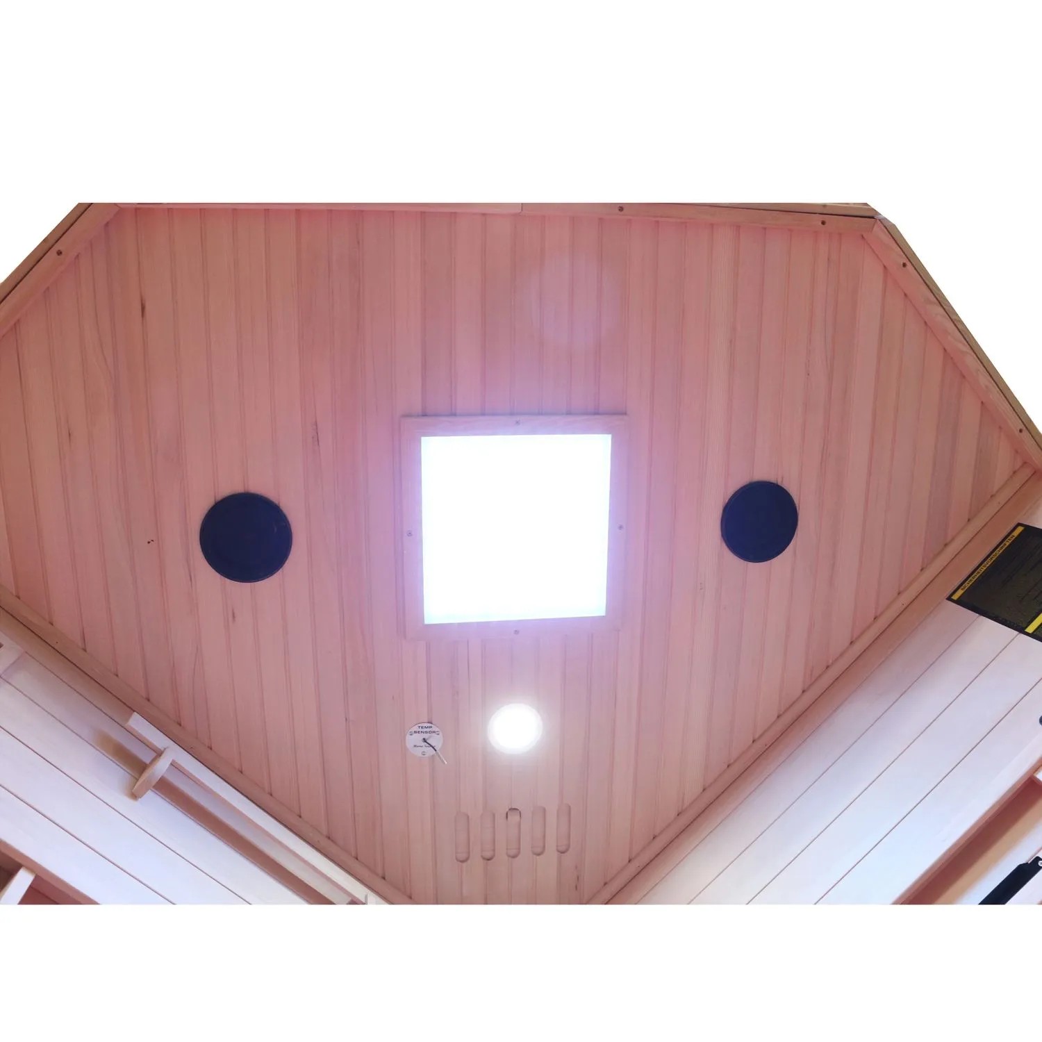 Innenansicht der Dewello Infrarotkabine Sauna aus Hemlock Tannenholz mit Deckenleuchte und Lautsprechern.
