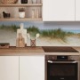 MySpotti Küchenrückwand mit Dünenpanorama als Spritzschutz hinter dem Kochfeld.