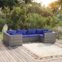 Graues 6-tlg. Garten-Lounge-Set aus Polyrattan mit blauen Kissen auf Holzterrasse.