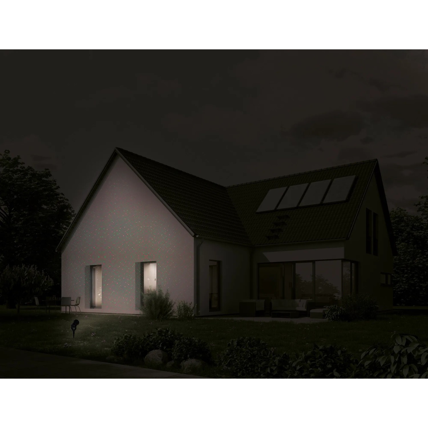 Näve LED Außenwandlaser Projektor, projiziert rot-grüne Punkte auf ein Haus.
