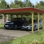 Skan Holz Doppelcarport Spreewald mit roter Blende, Holzkonstruktion für zwei PKW.