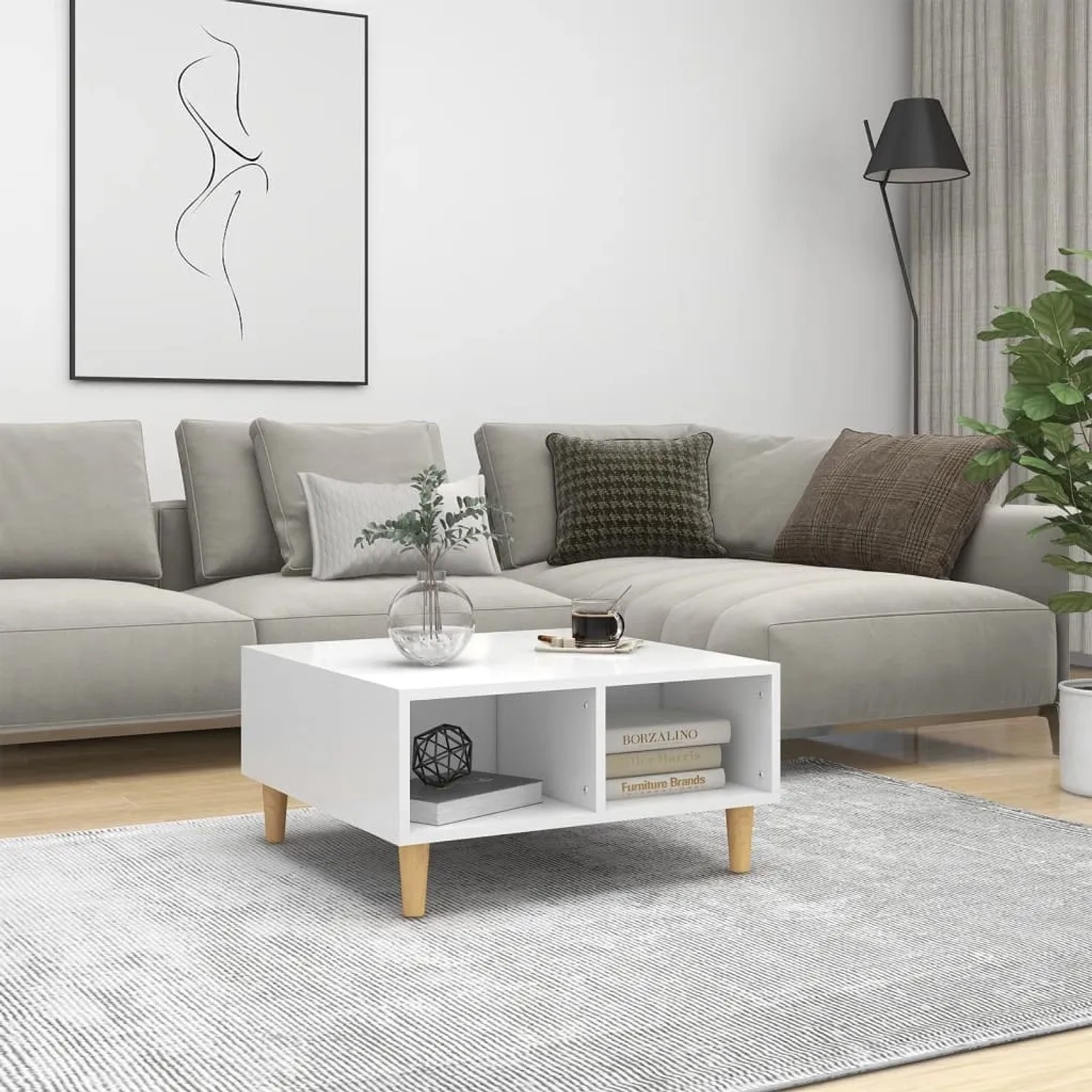 Weißer vidaXL Couchtisch mit Holzbeinen und zwei Ablagefächern im Wohnzimmer. Modernes Design.