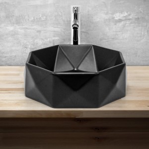 Schwarzes, rundes ML-Design Handwaschbecken mit Diamant Design und Armatur.