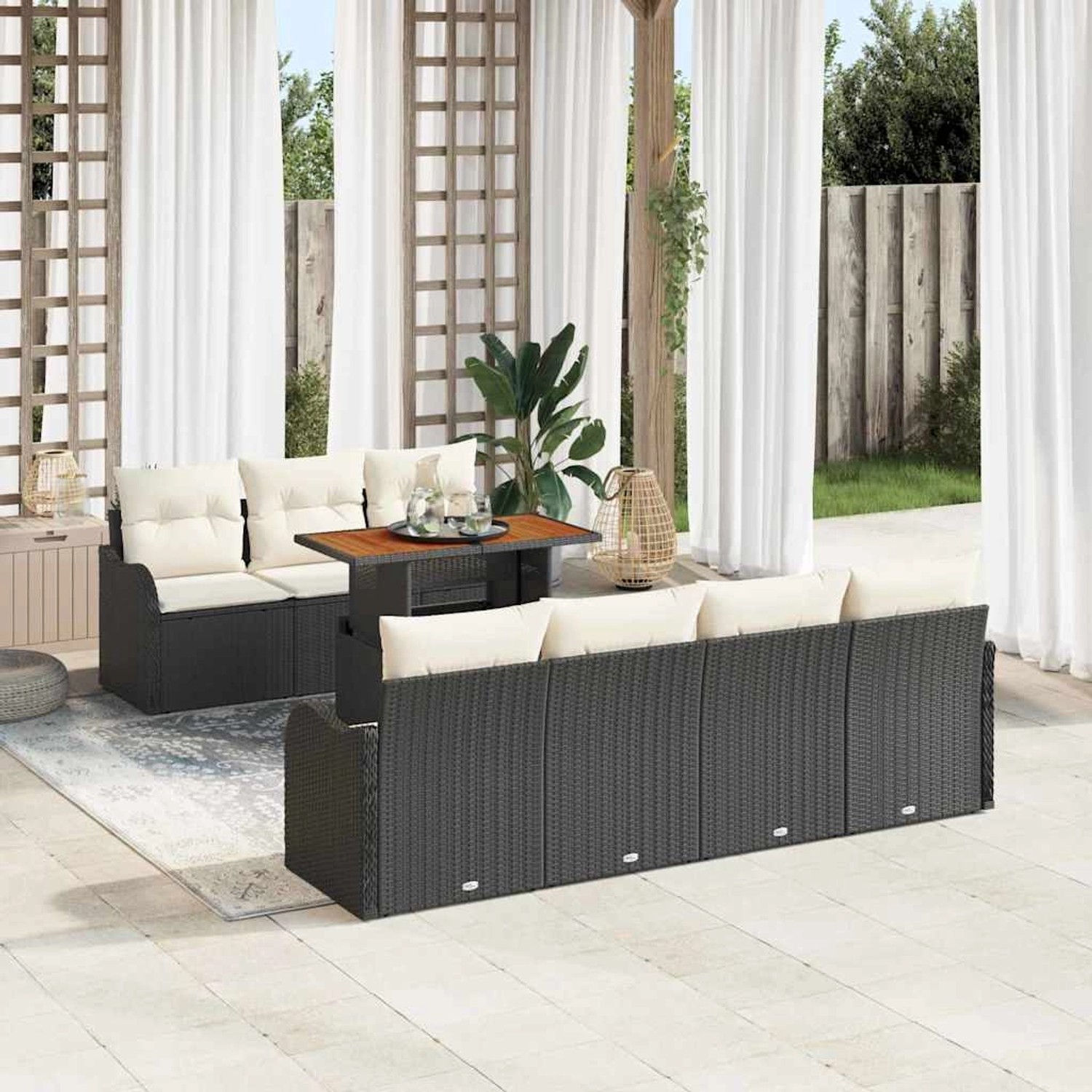 Schwarzes 8-teiliges Garten-Sofa-Set aus Poly Rattan mit Tisch und Kissen.
