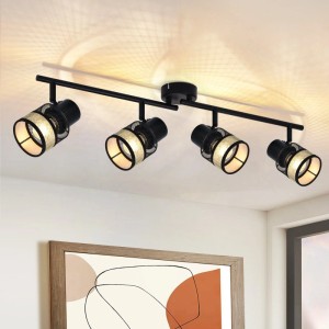 Schwarze 4-flammige Vintage Deckenleuchte mit drehbaren Spots, Metallgitter und goldenen Stoffschirmen.