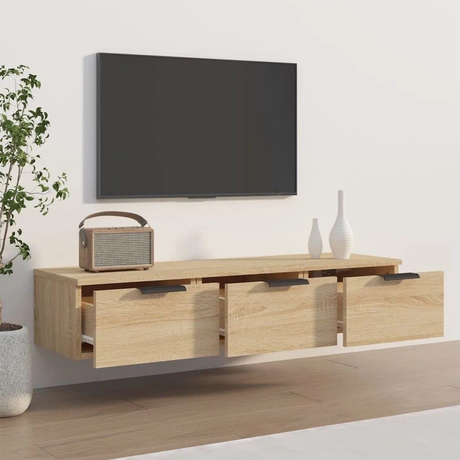Wandschrank Sonoma-Eiche mit drei Schubladen, montiert im Wohnzimmer.