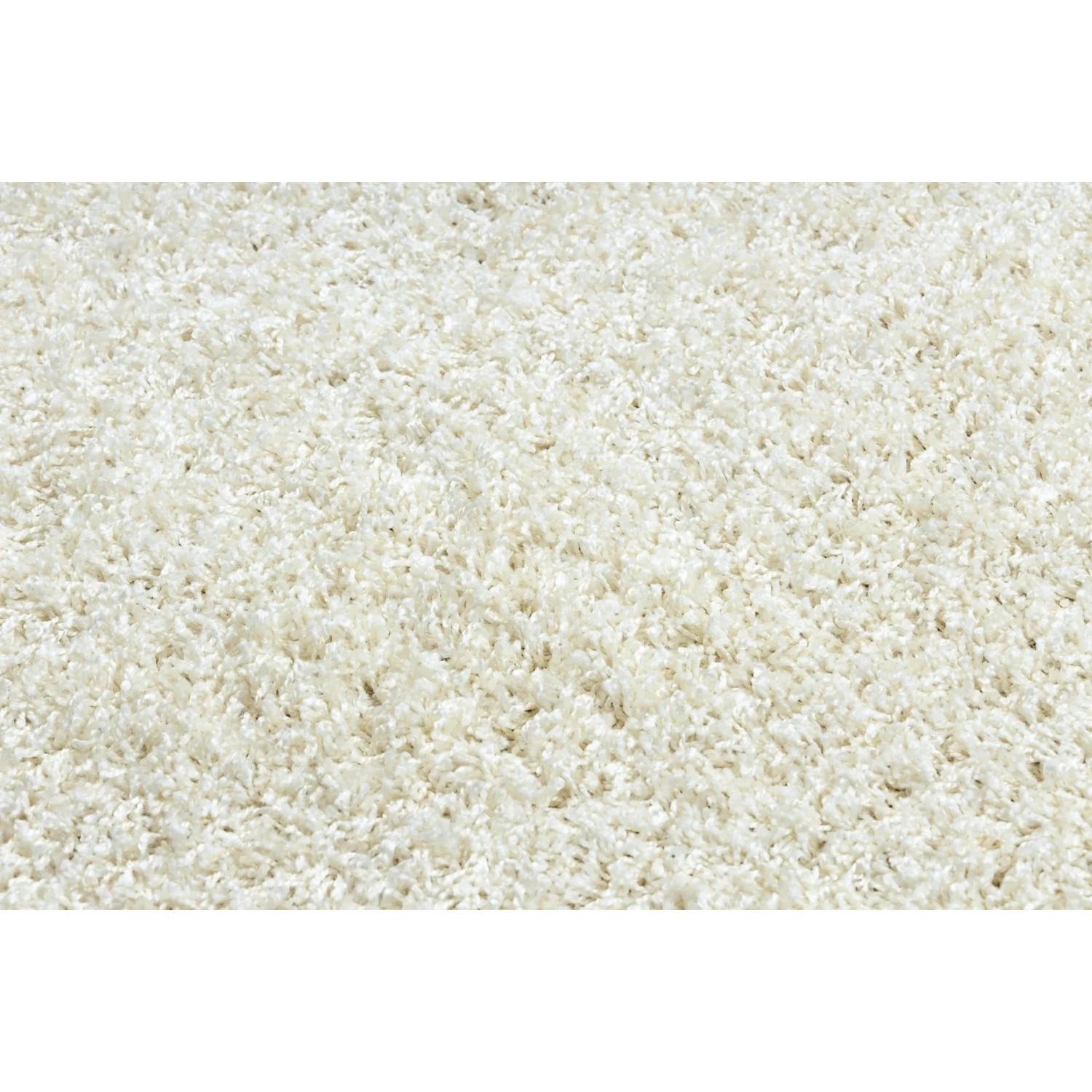 Cremefarbener RugsX Soffi Shaggy-Teppich mit langem, flauschigem Flor. Weiche Textur für gemütliche Räume.