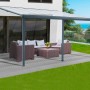 Floraworld Terrassenüberdachung in Anthrazit mit Gartenmöbeln auf Terrasse.