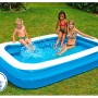 Blauer Family Pool 262x175x50 cm mit spielenden Kindern im Garten.