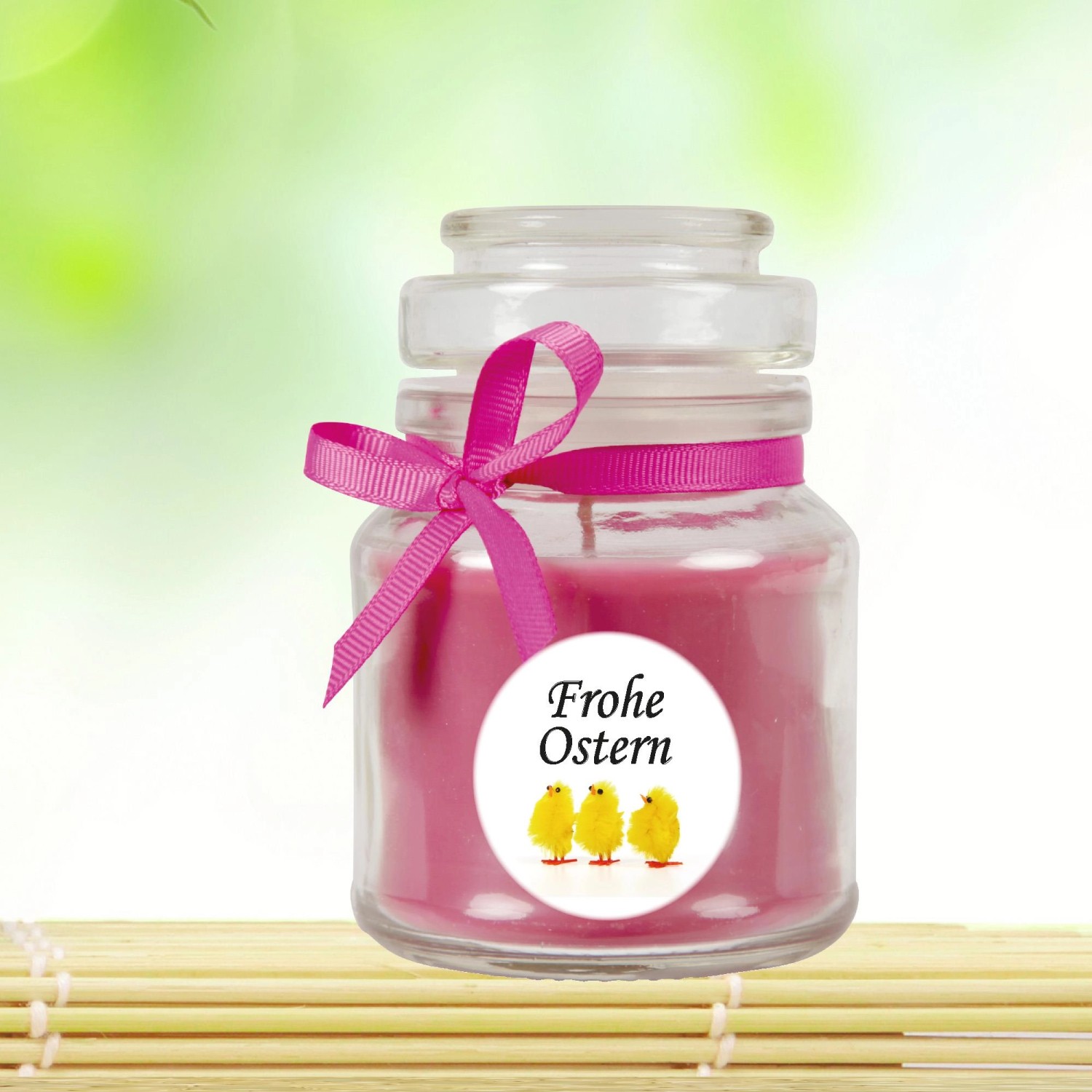 Duftkerze im Glas mit Schleife und Oster-Motiv (Küken).