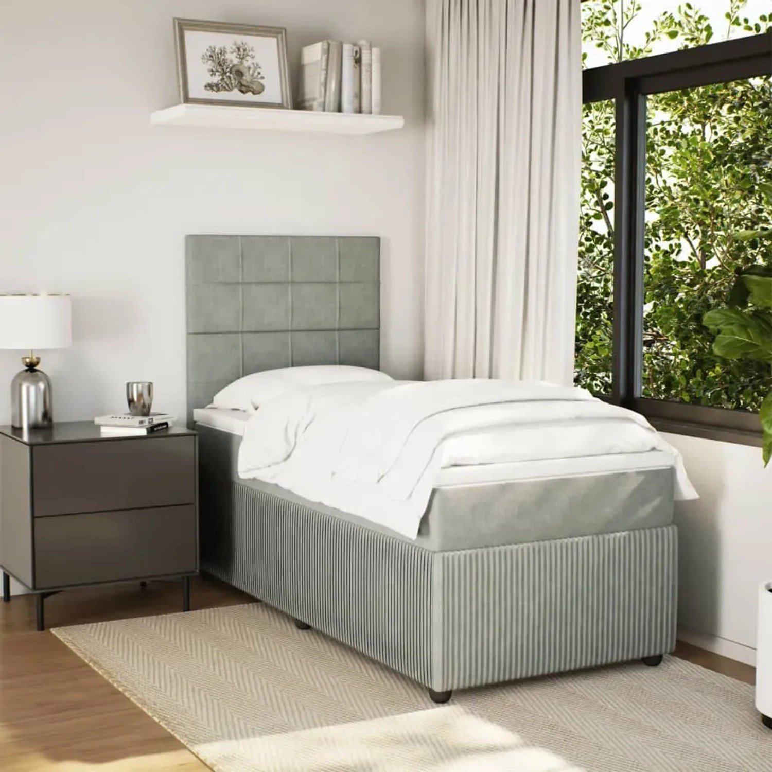 Helles Boxspringbett 90x190 cm mit Matratze und Kopfteil im Schlafzimmer.