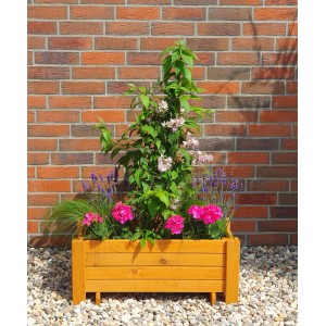 Promadino Pflanzkasten Romantica aus Kiefernholz mit Blumen und Pflanzen vor einer Backsteinmauer.