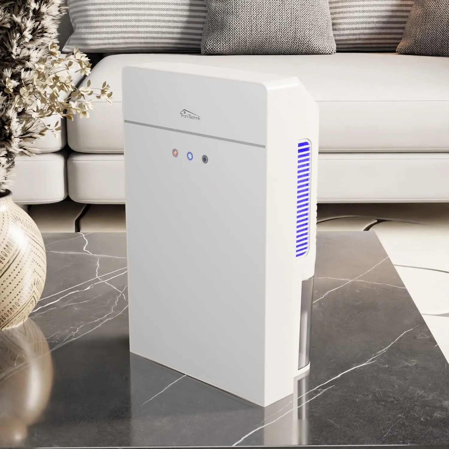 Weißer TroniTechnik Luftentfeuchter EF03 mit 2,2L Tank und Glasfront auf Tisch.