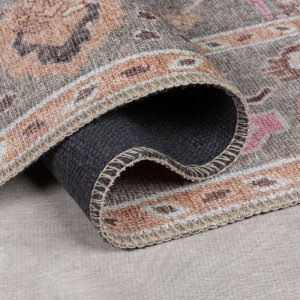 Flair Rugs Vintageteppich Una Floral. Gerollter Teppich in Grau mit floralem Muster, zeigt weiche Oberfläche und rutschfeste Unterseite.