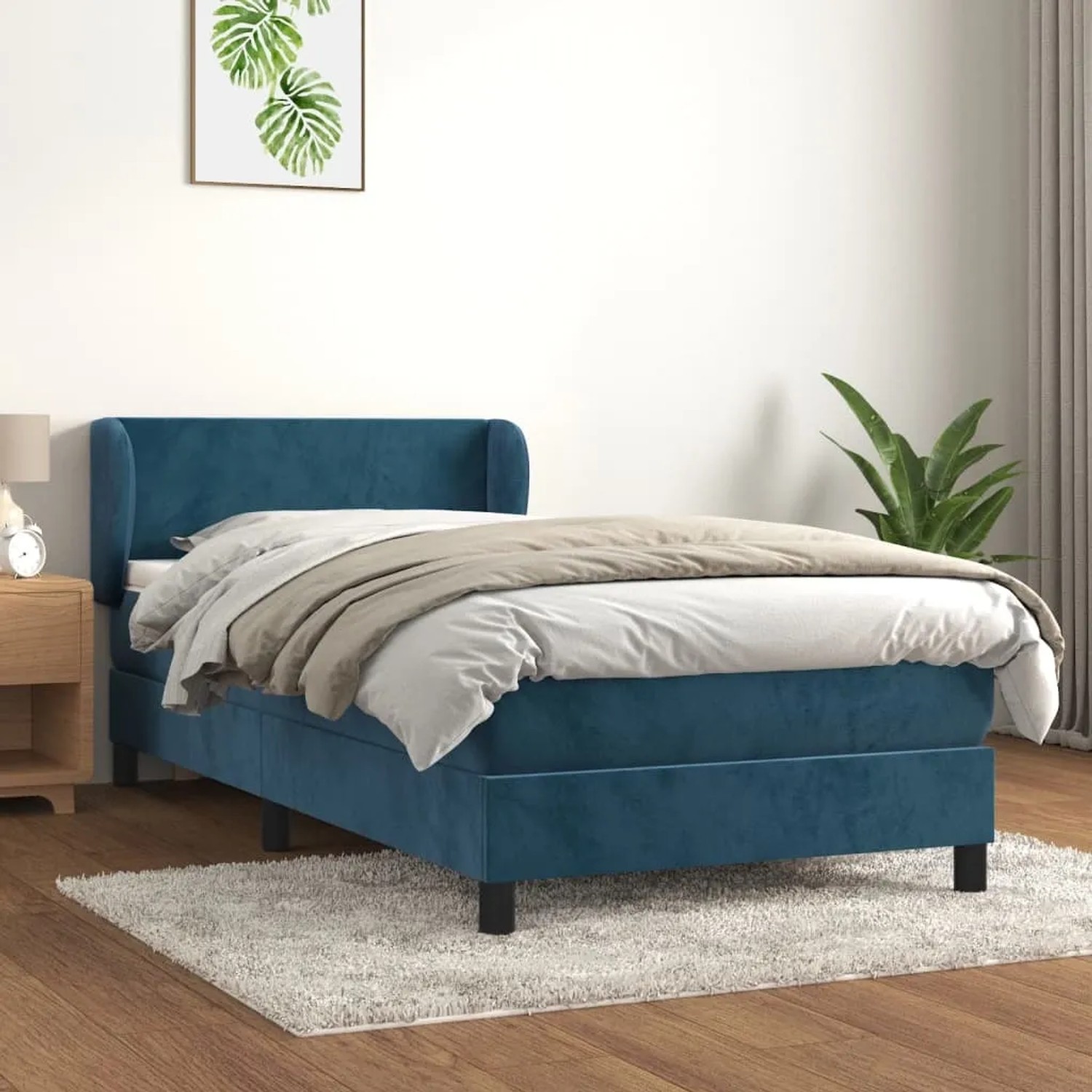 Boxspringbett in Dunkelblau mit Matratze und Kopfteil, Samtbezug, 90x190 cm.