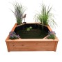 Promadino Hochteich mit Solarpumpe und 4 Pflanzzonen aus Kiefernholz, bepflanzt mit Blumen und Gräsern.