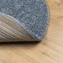 Blauer, runder Shaggy Teppich (Ø 100 cm) mit hochflorigem Flor. Detailaufnahme der Teppichrückseite.