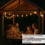 Weiße Partylichterkette mit warmweißen LED-Kugellampen (50xE27) über einer Familie im Gartenpavillon.