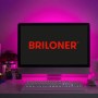 Briloner LED-Streifen Flexband 3m, mehrfarbig, hinter einem Monitor angebracht.