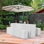 Weiße 3-teilige Beautissu Biertischhusse und zwei Bierbankhussen auf einer Festzeltgarnitur im Garten.