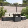 Schwarzes 6-teiliges vidaXL Garten-Sofa-Set aus Poly Rattan mit höhenverstellbarem Tisch.