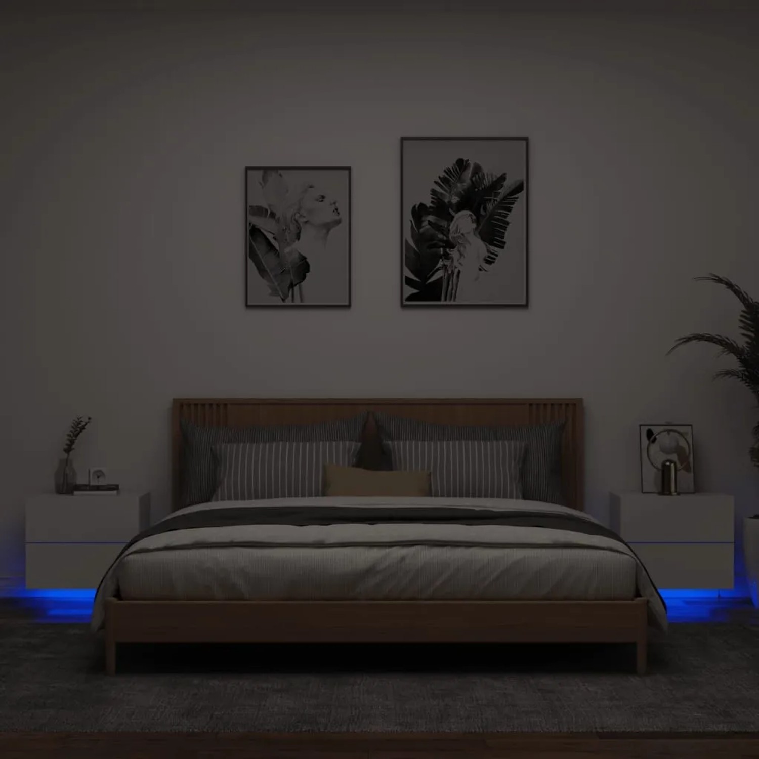 Zwei weiße Wand-Nachttische mit LED-Beleuchtung unter einem Bett.