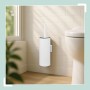 Weiße Toilettenbürste aus Edelstahl und Kunststoff, wandmontiert neben WC. Ideal für Bad & Gäste-WC.