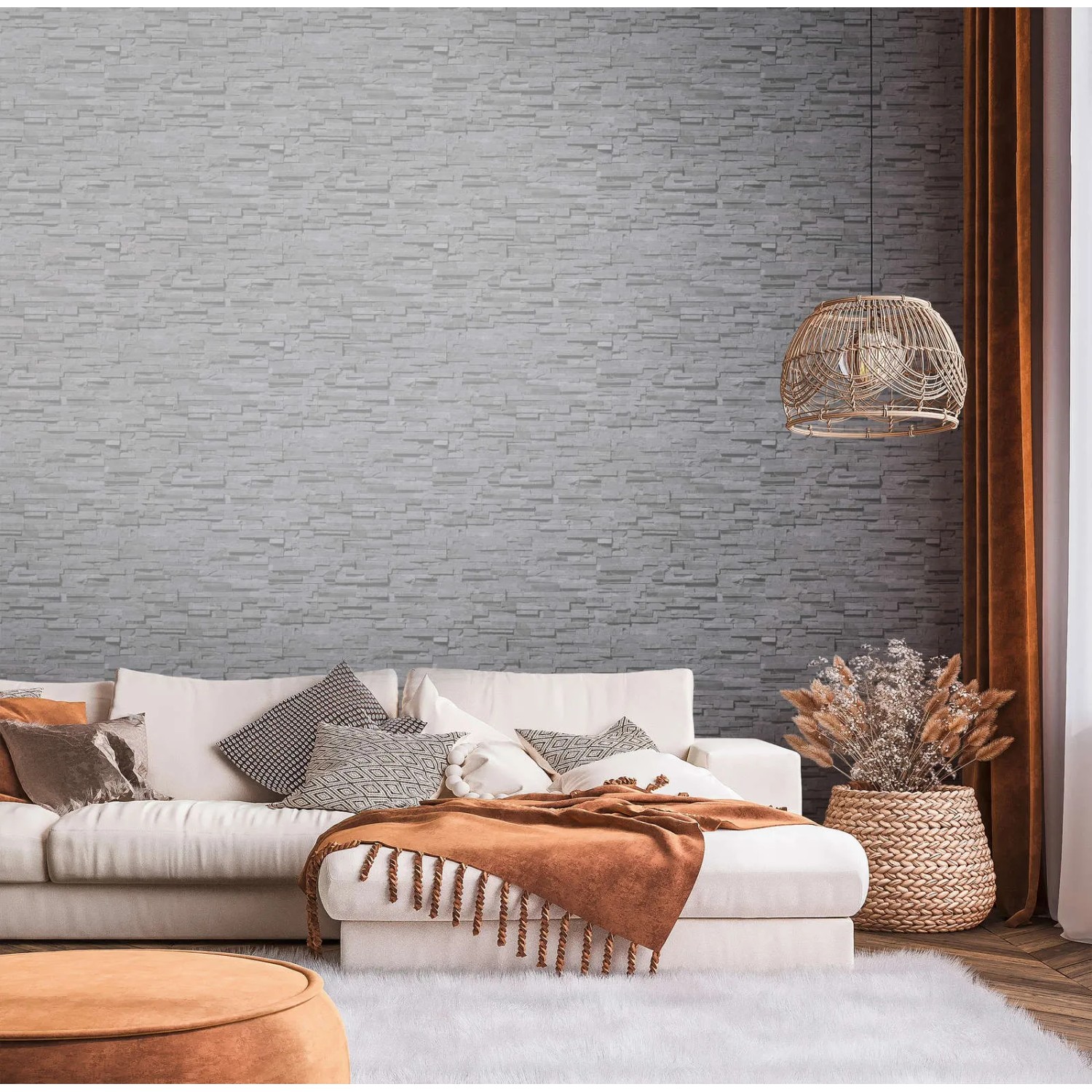 Anthrazitfarbene Bricoflor Bruchstein Tapete in 3D-Optik an Wohnzimmerwand.