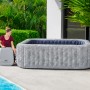 Bestway Whirlpool San Francisco HydroJet Pro für 7 Personen in Marmor-Optik neben Pool.