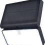 Schwarze Lutec LED Solar-Wandleuchte Tuda mit Bewegungsmelder und Solarpanel.