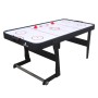 Schwarzer, faltbarer Cougar Airhockey Tisch Icing XL mit zwei roten Pucks.