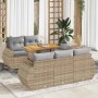 Beige 6-tlg. Garten-Sofagarnitur aus Rattan mit Tisch und hellgrauen Kissen.