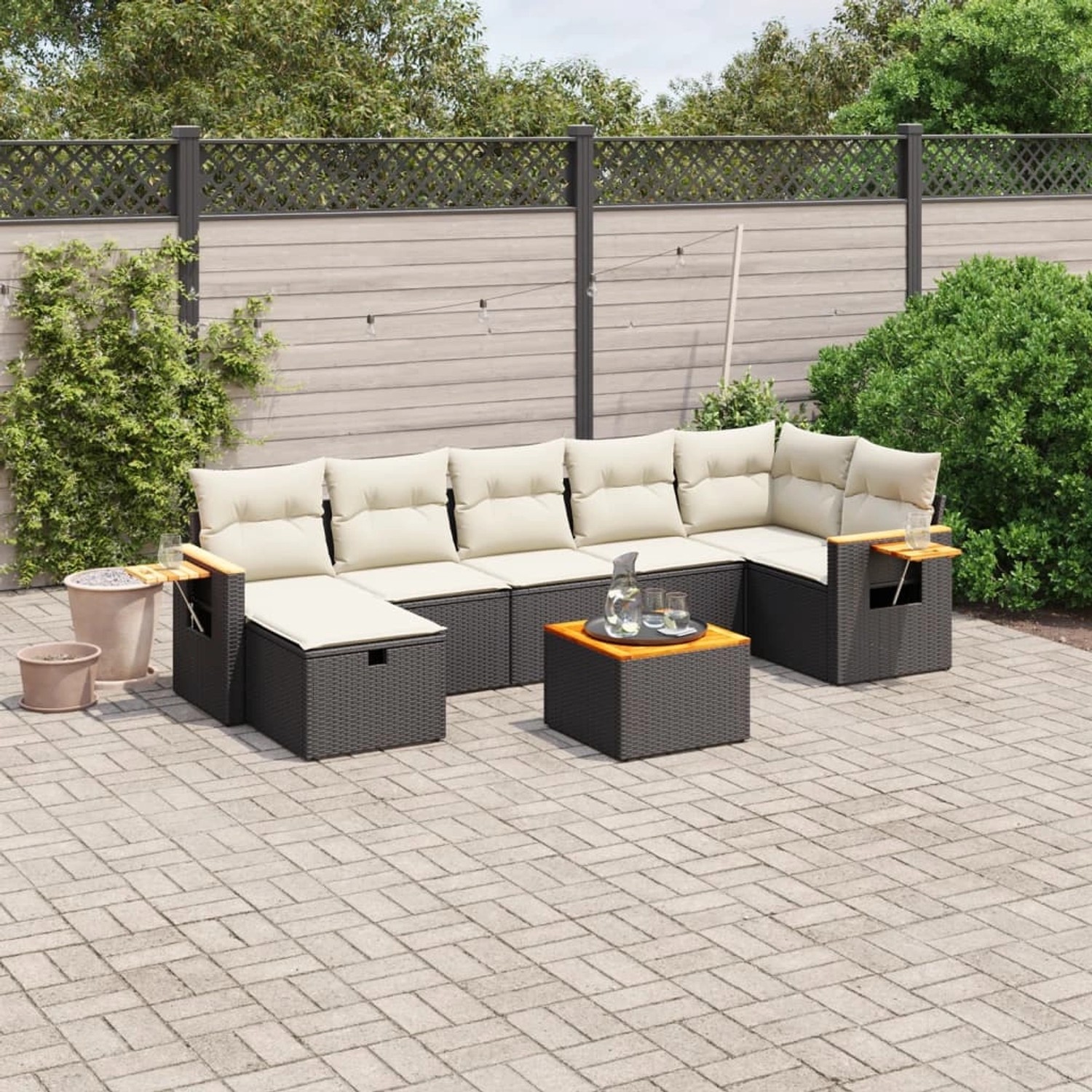 Schwarze 8-tlg. vidaXL Garten-Sofagarnitur aus Rattan mit cremefarbenen Kissen.