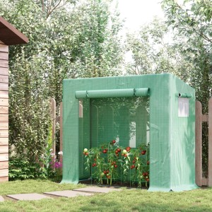 Grünes Furnicato Foliengewächshaus mit Rolltür und Seitenfenstern im Garten.
