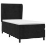 Schwarzes Boxspringbett (90x190 cm) mit Matratze und Samtbezug. Bett mit hohem Kopfteil.